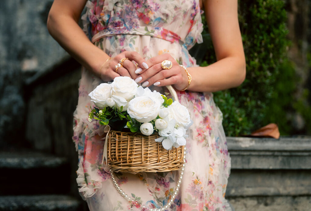 Woman holding white flowers at Villa Carlotta in Lake Como Italy