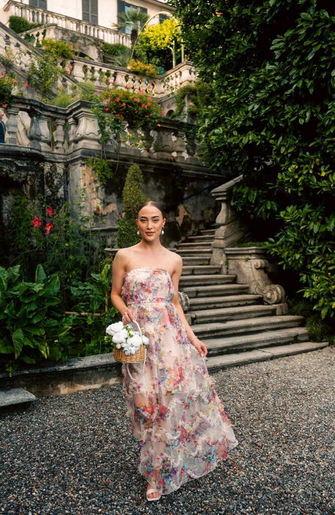 Young Woman in front of green plants at Villa Carlotta in Lake Como