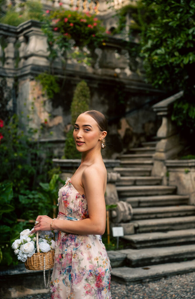 Young Woman in front of green plants at Villa Carlotta in Lake Como