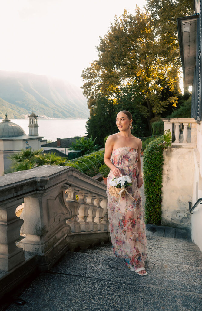 Young Woman in front of green plants at Villa Carlotta in Lake Como