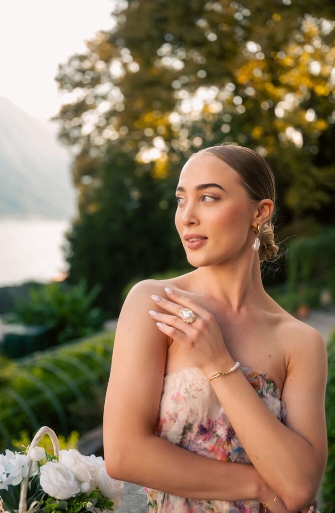 Young Woman in front of green plants at Villa Carlotta in Lake Como