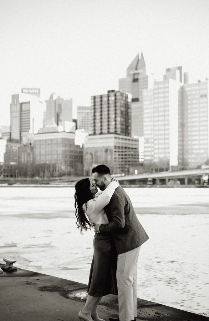 Couple embracing each other in front of River at the North Shore