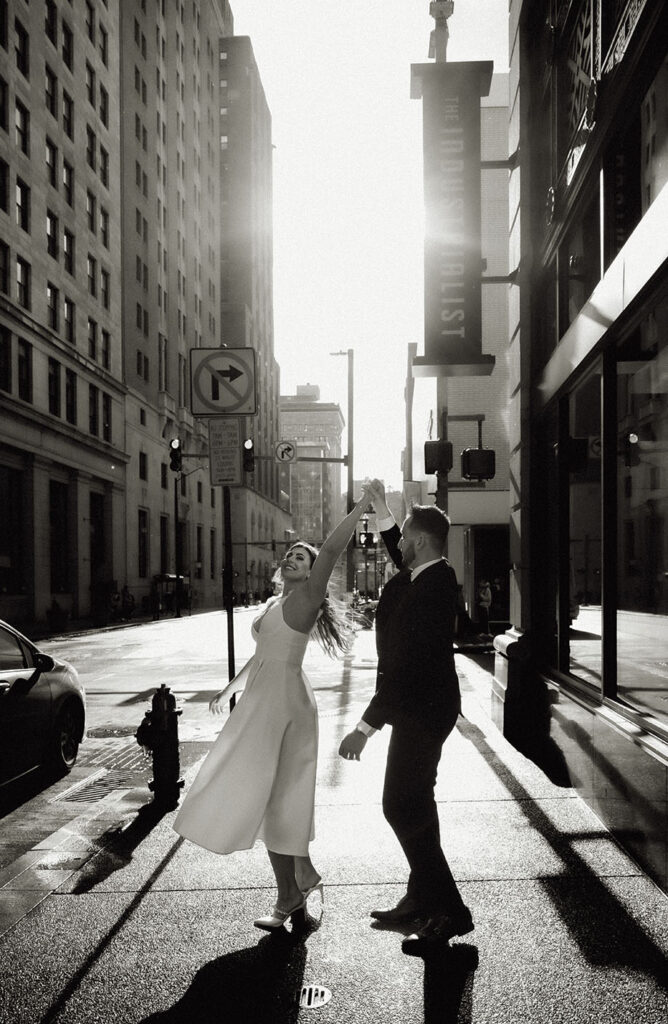 Couple dancing during engagement session in Downtown Pittsburgh