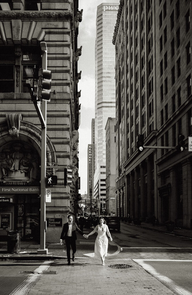 Couple crossing the street during city engagement