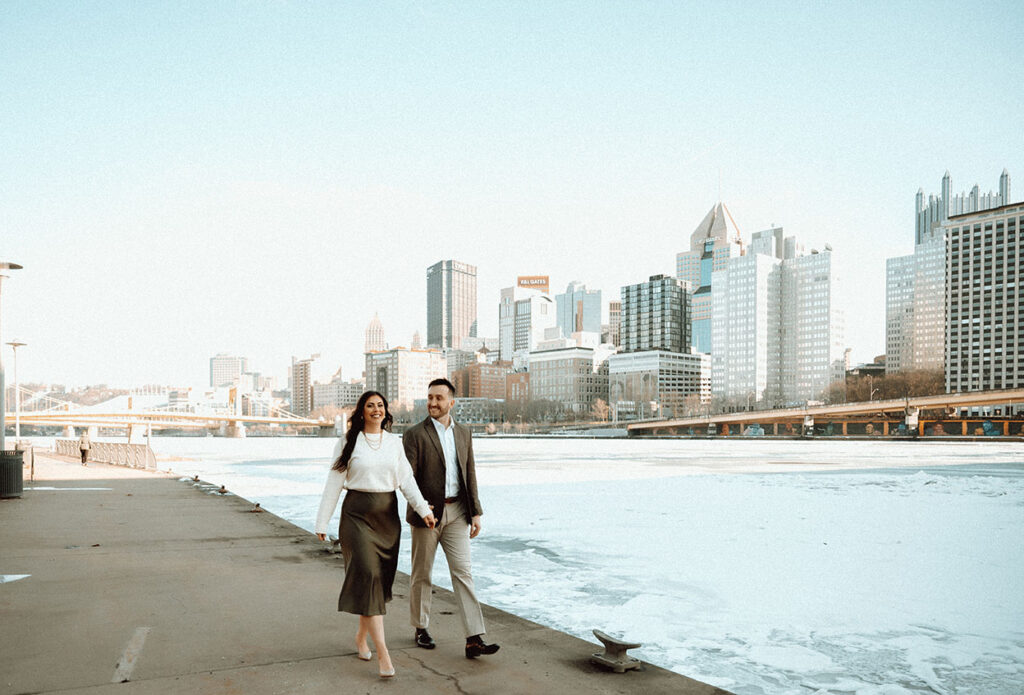 Couple walking Pittsburgh's Riverwalk in the North Shore