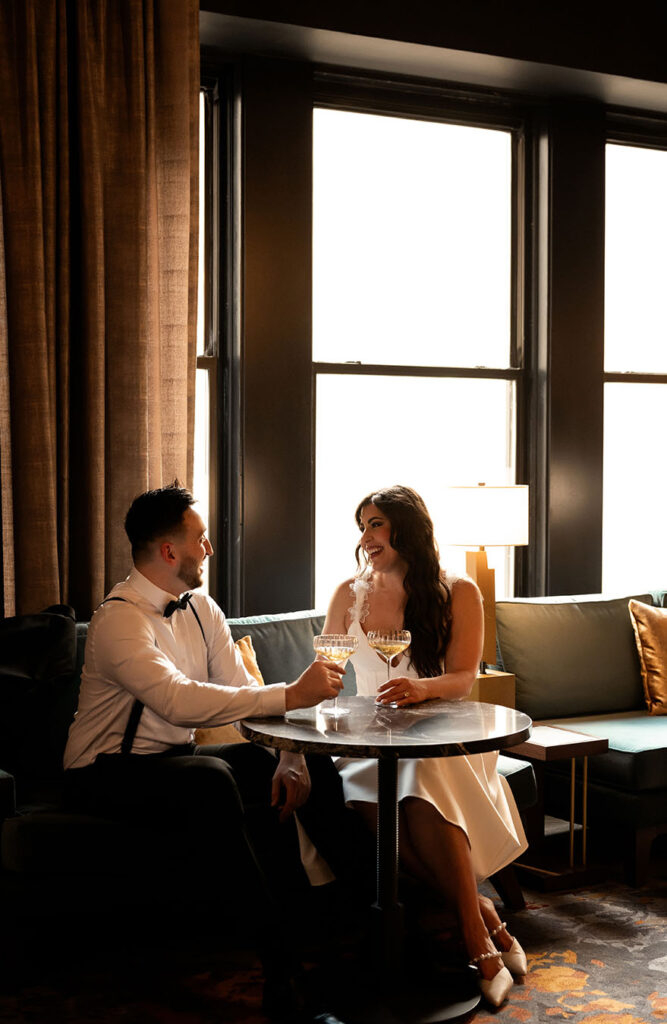 Engaged Couple Drinking and celebrating their engagement photos