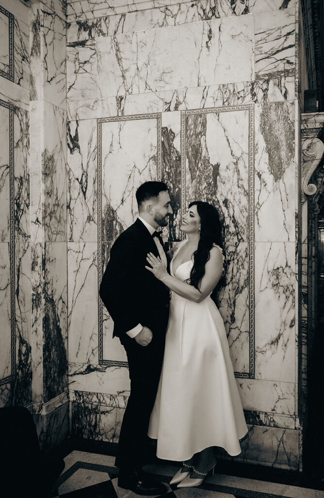 Couple stand at their Engagement photo at the industrialist hotel