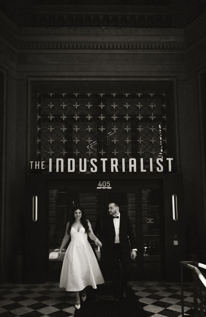 Couple Walks out of the Industrialist Hotel in Pittsburgh