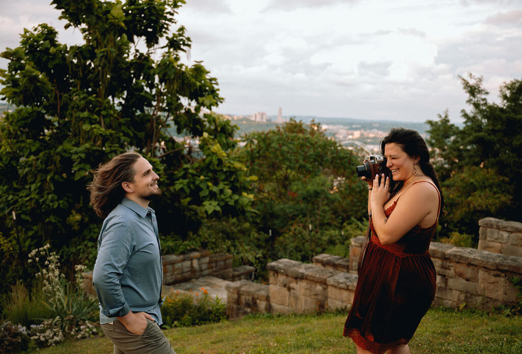 Couple take pictures during the anniversary photo shoot in Emerald Park