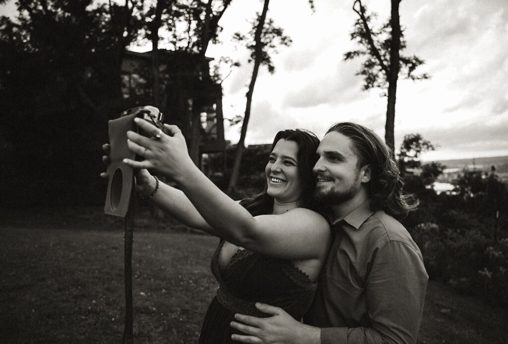 Couple take pictures during the anniversary photo shoot in Emerald Park