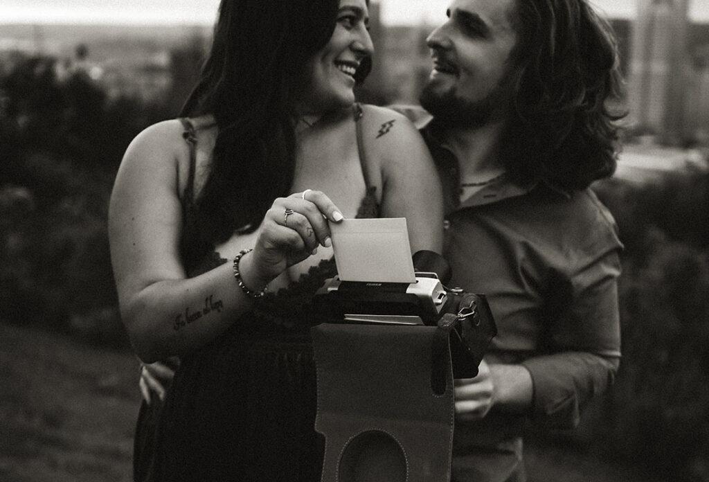 Couple take pictures during the anniversary photo shoot in Emerald Park