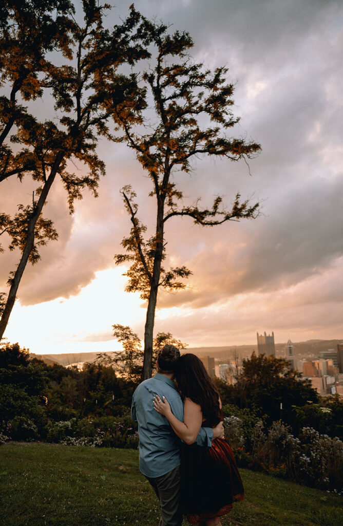 Couple watch the sunset in Pittsburgh