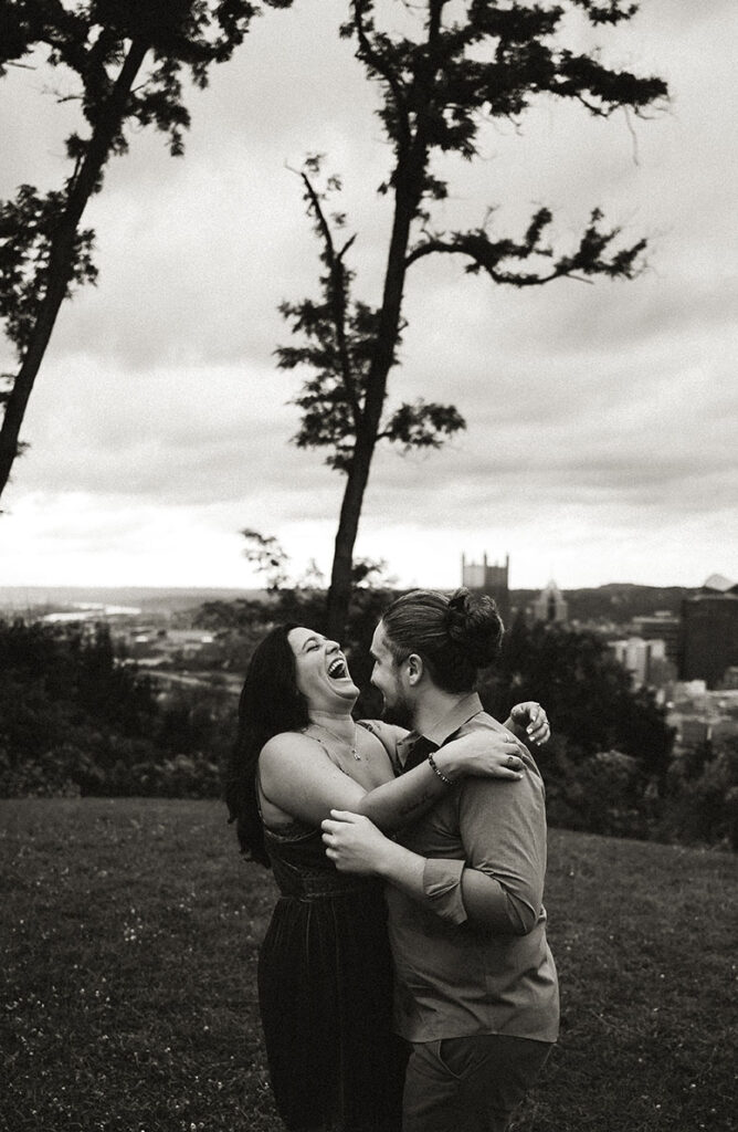 Couple Laughing during their anniversary celebration in Pittsburgh