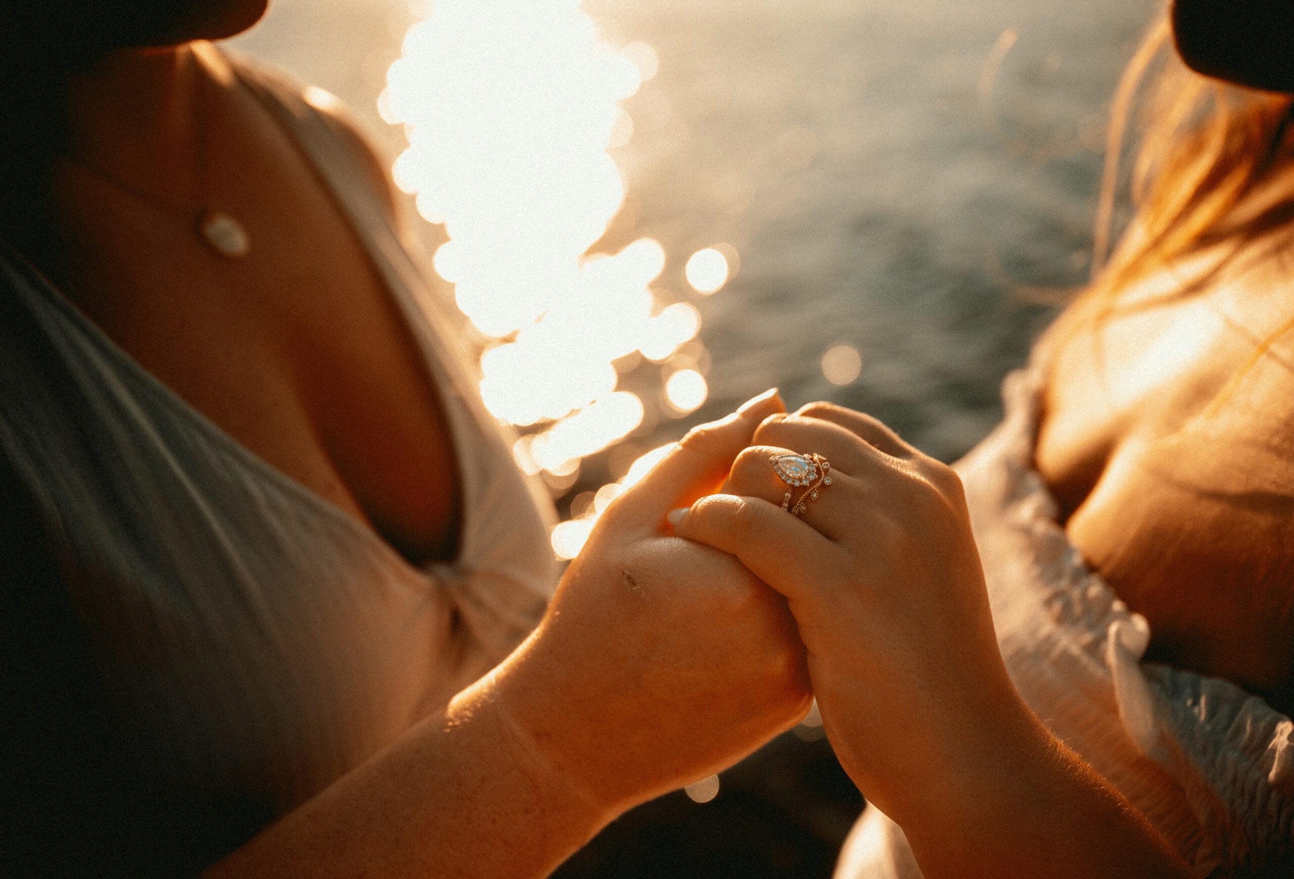 Two Woman holding hands at Presque Isle in Erie