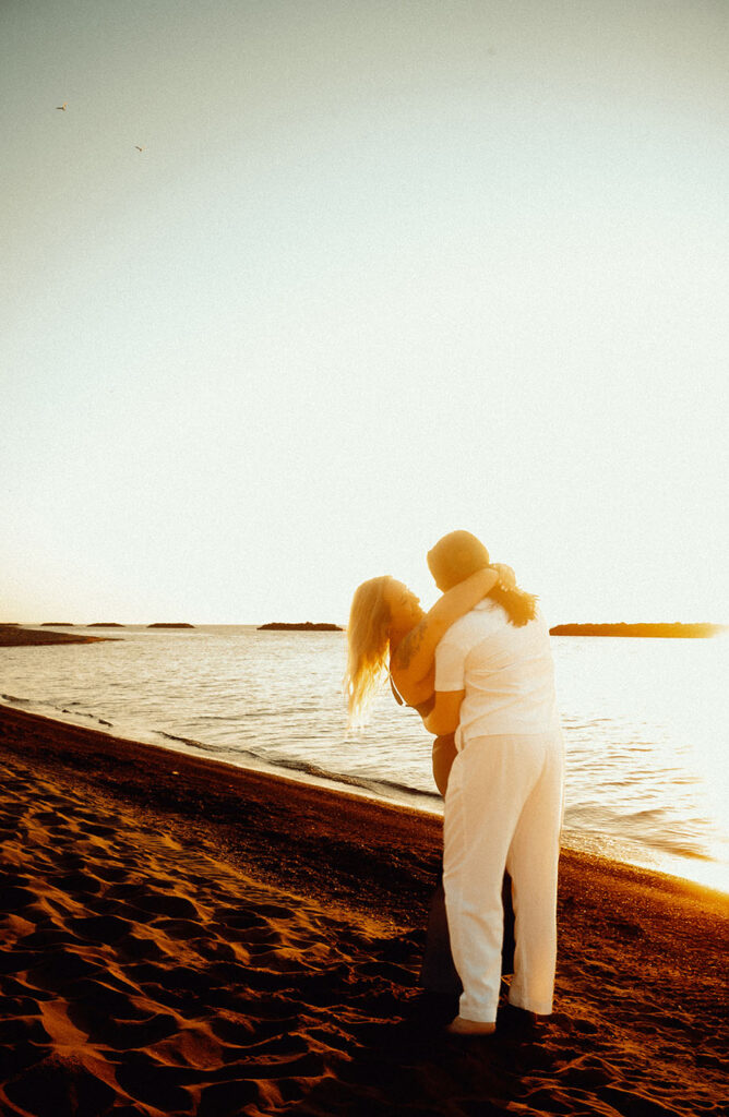 Engagement during sunset at Presque Isle in Erie PA