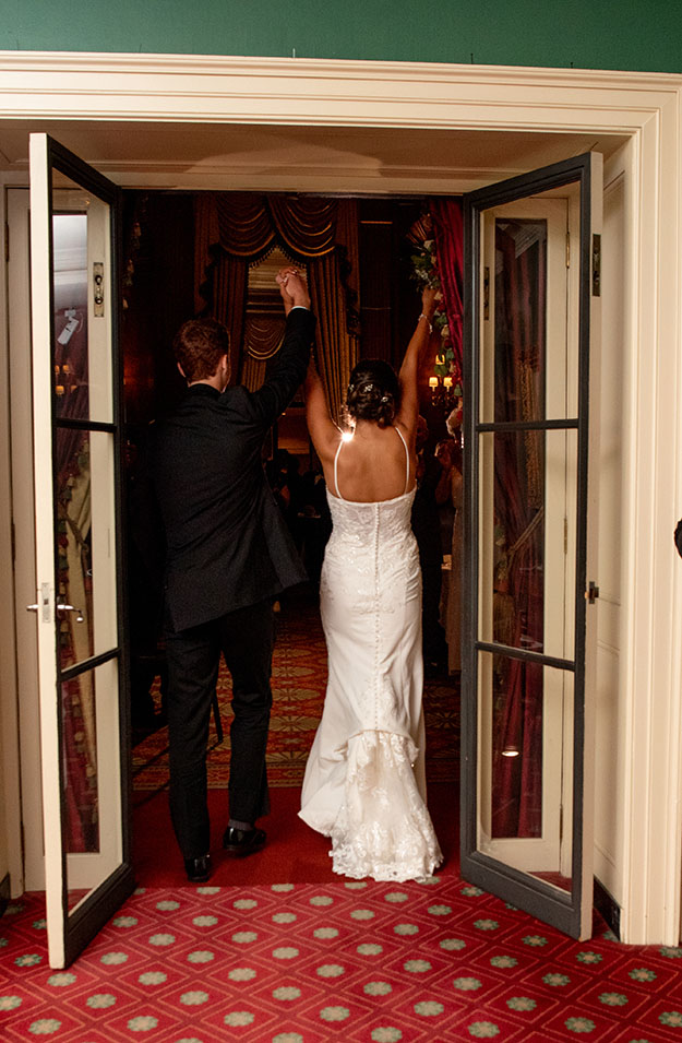 Bride and Groom Entering their wedding reception at Duquesne Club Wedding