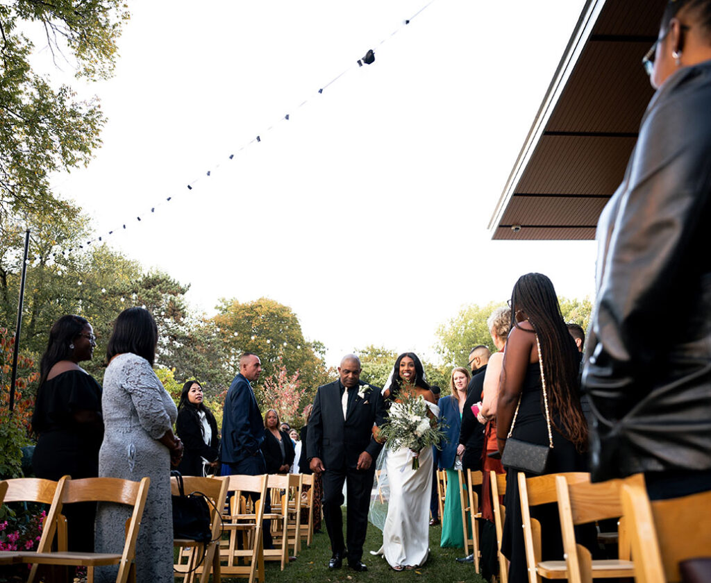 Bride walking down the aisle with his father