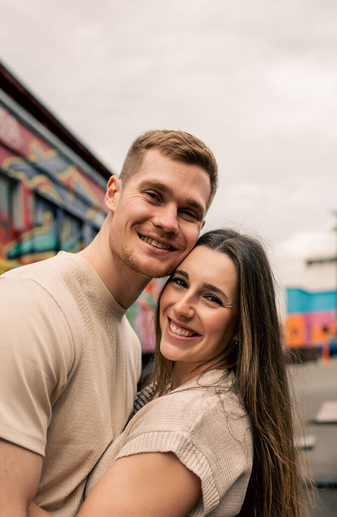 Romantic rainy engagement photo at The Highline overlooking the Monongahela River and downtown Pittsburgh.