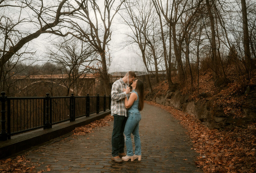 Close Up between couple during their rainy engagement session in Pittsburgh’s Schenley Park.