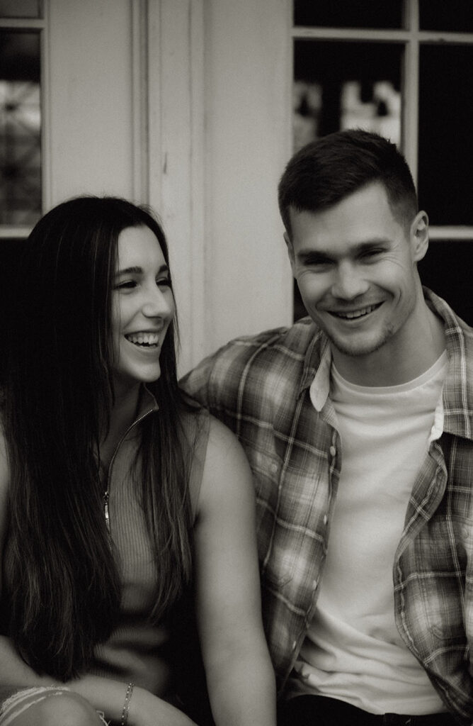 Close Up of couple laughing during their rainy engagement session in Pittsburgh’s Schenley Park.