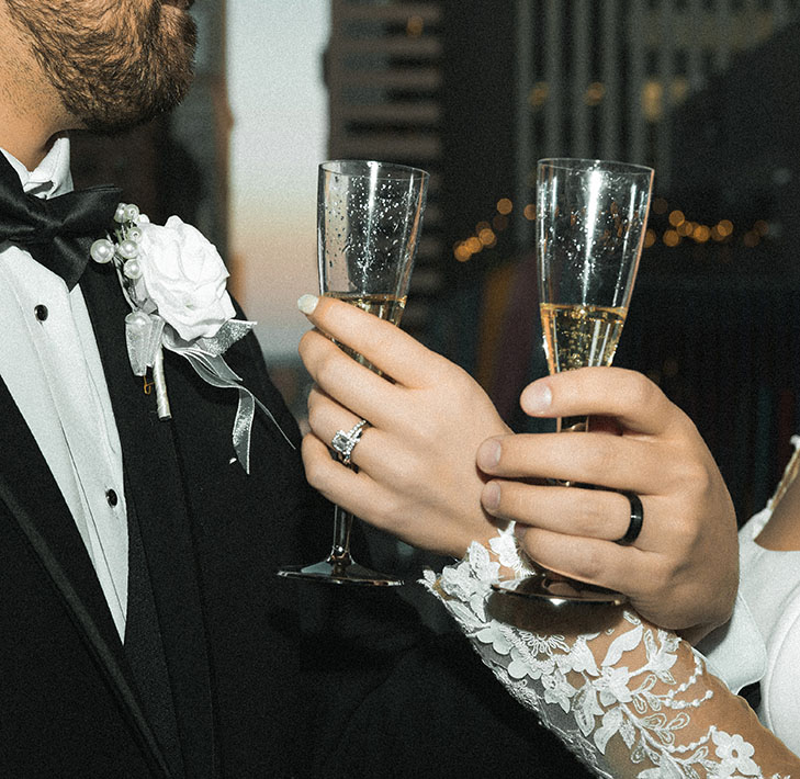 Champagne glasses with engagement ring