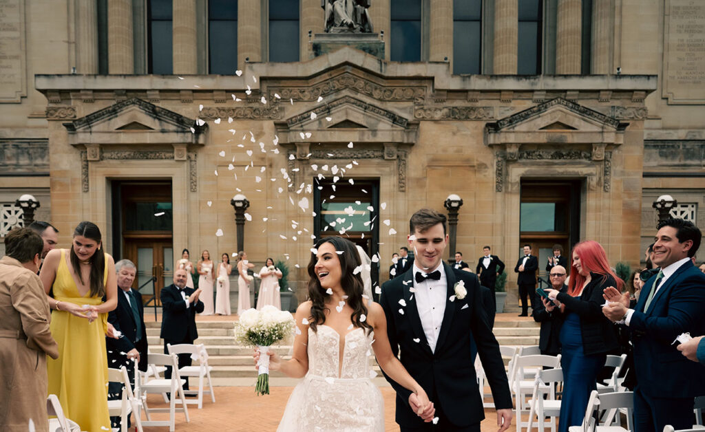Bride and Groom walking out of their ceremony at Soldiers and Sailors Wedding
