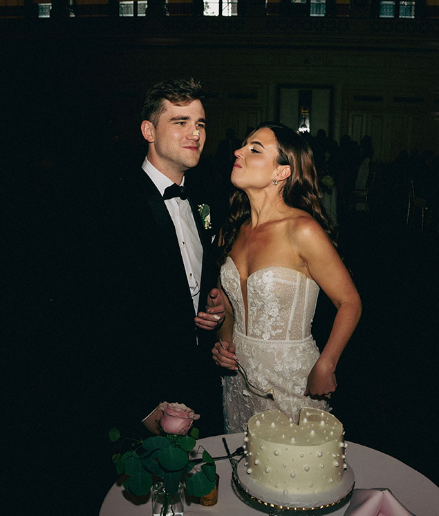 Bride and Groom During Cake Cutting 