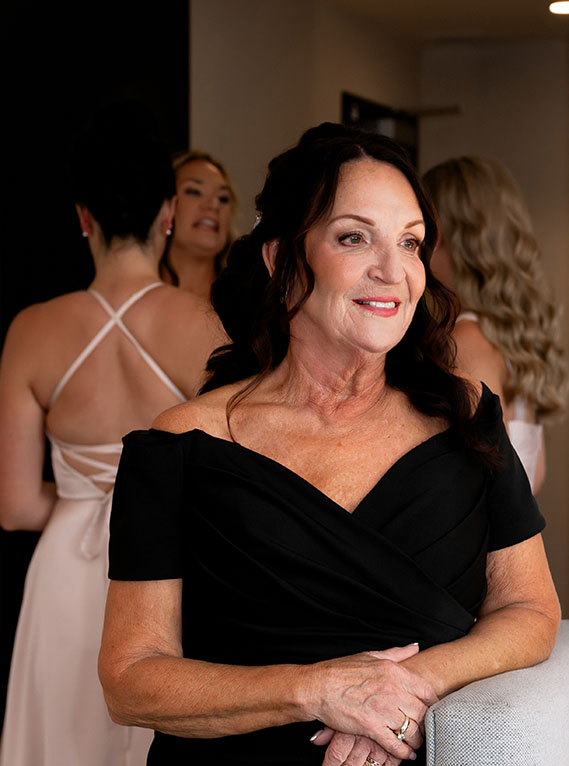 Mother of the Bride looking at her while she gets ready