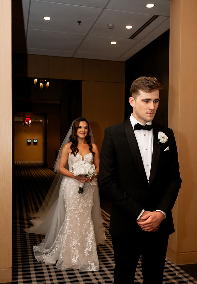 Bride waits for Groom to turn around for their first look at the Oaklander