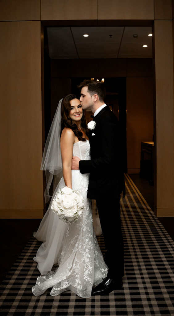 Bride and Groom kissing at the Oaklander