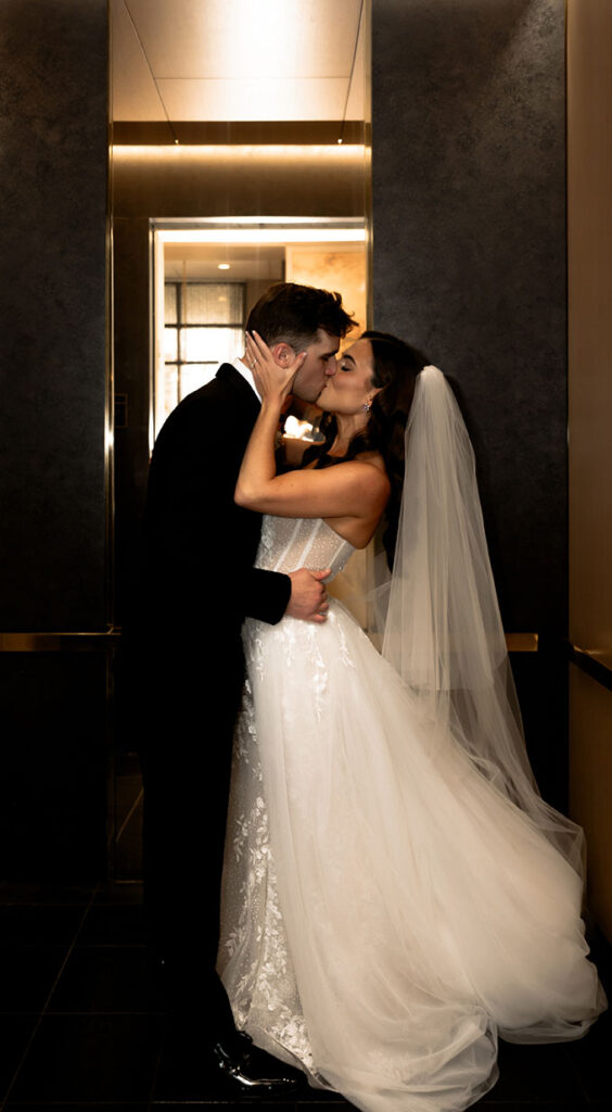Bride and Groom kiss after their first look at the Oaklander