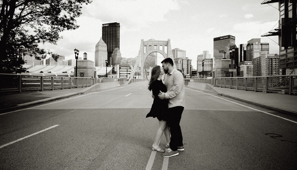 BW Couple Kissing in front of Andy Warhol Bridge in the North Shore
