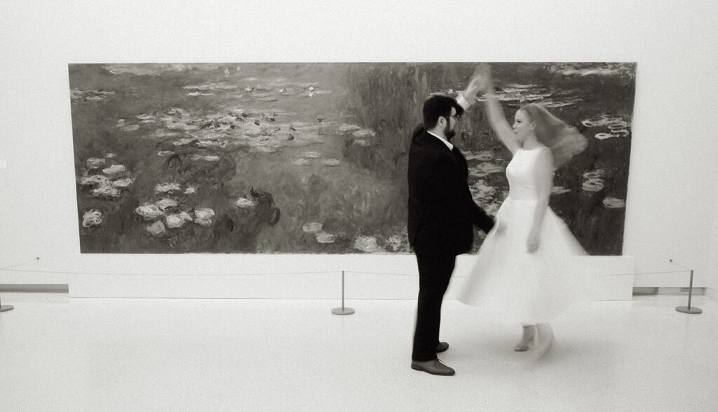 Man spins fiance in front of painting at Carnegie Museum of art Engagement