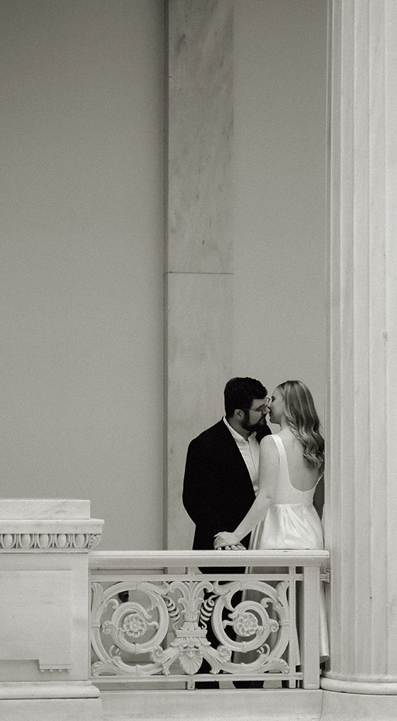 BW Couple stand at the Hall of Sculpture in Carnegie Museum of Art in Pittsburgh
