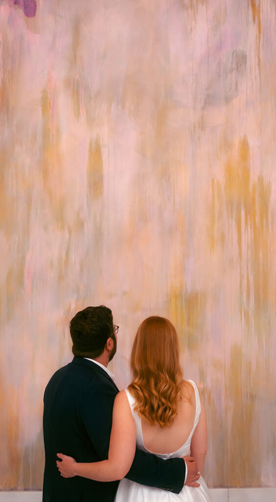 Couple looking away from groom at the Hall of Sculpture in Carnegie Museum of Art in Pittsburgh