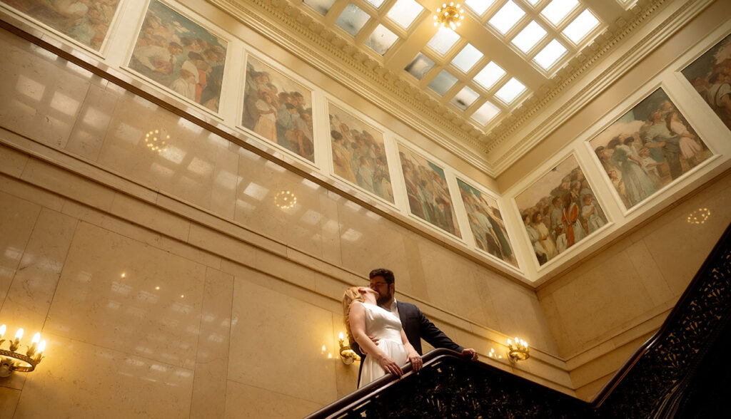 Couple standing at Carnegie Staircase during Engagement
