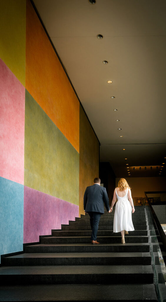 Couple going up the stairs at Carnegie Museum of Art in Pittsburgh Engagement