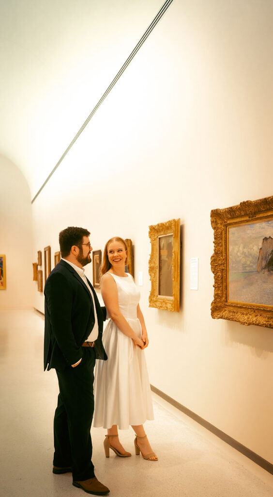 Couple look at art during Engagement Photos in Pittsburgh