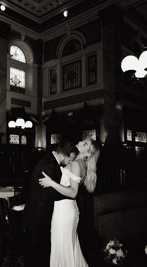 BW Groom Kissing at grand concourse in an editorial Wedding