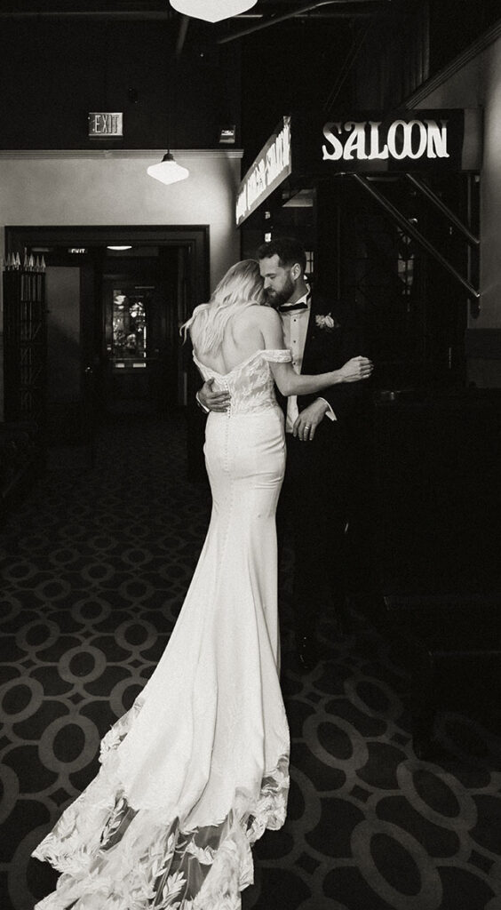 BW Bride and Groom holding each other at grand concourse wedding
