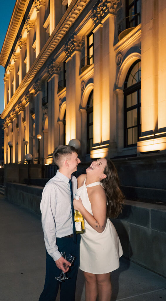 Couple laughing during romantic engagement 