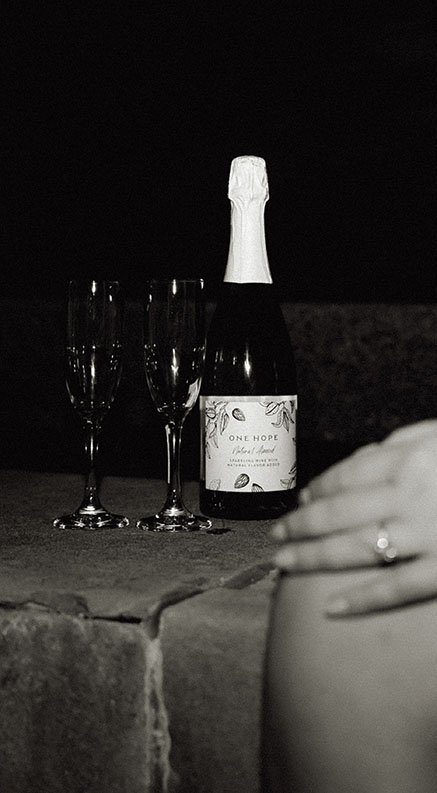 BW Champagne bottle and glasses with Engagement Ring