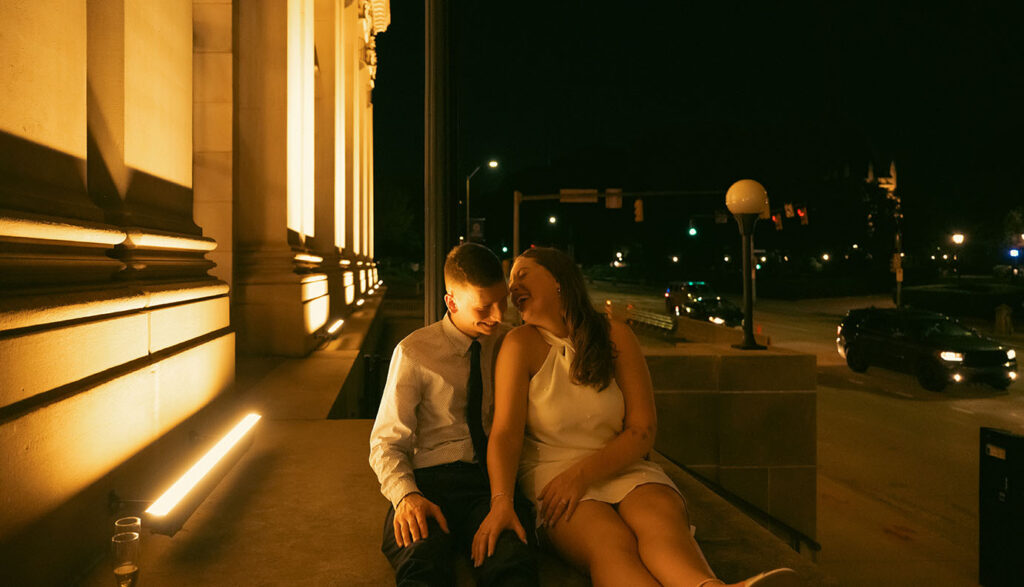 Couple Laughing during their romantic engagement in Pittsburgh