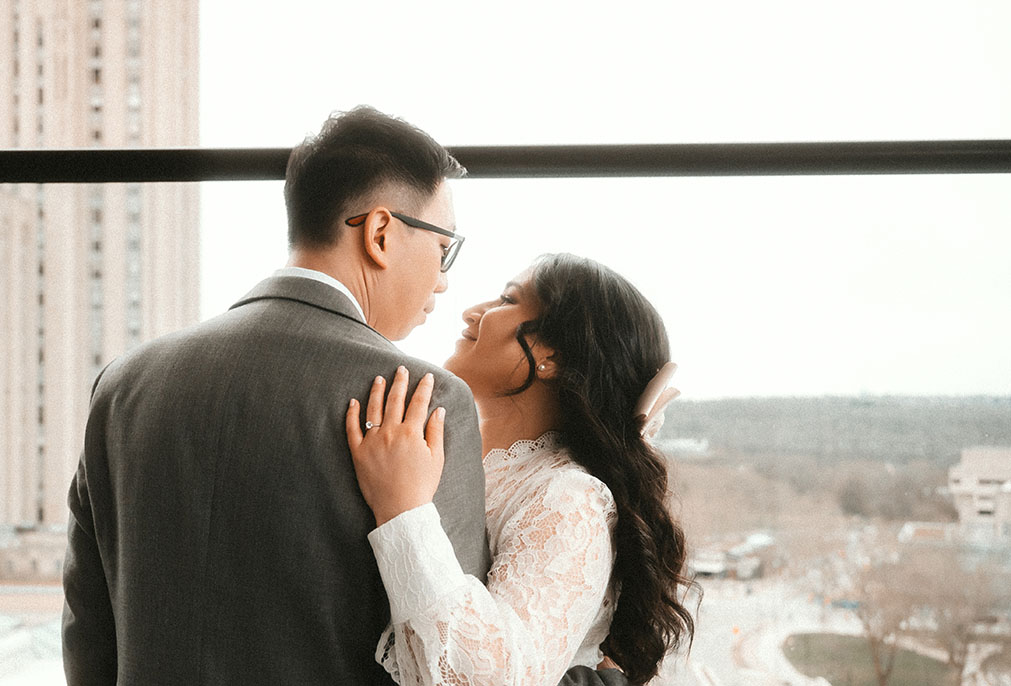 Couple Looking at each other during their engagement at the Oaklander