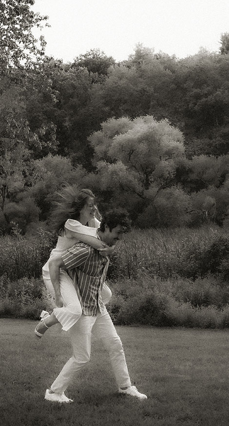 Couple Run around during romantic engagement in Pittsburgh