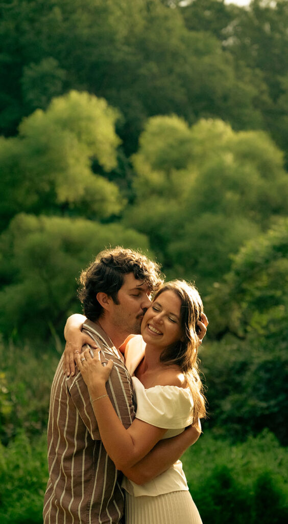 Man kiss woman during engagement photos in North Park