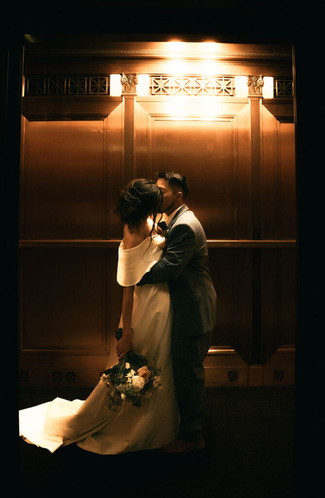 Bride and Groom Kiss at Carnegie Museum of Art Elevator