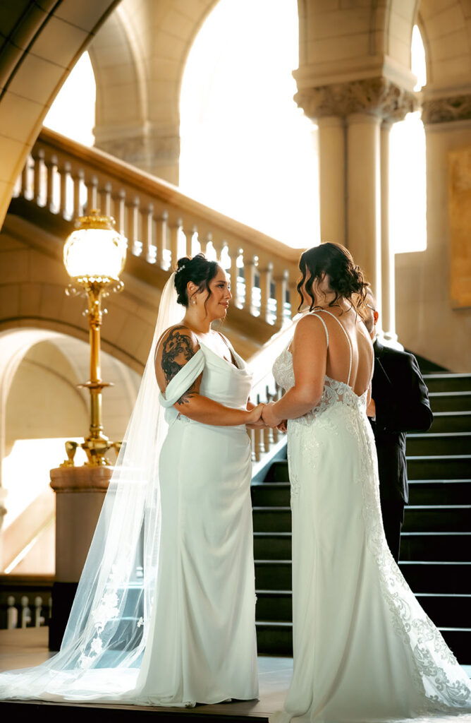 Couple exchanging vows during their intimate courthouse wedding ceremony