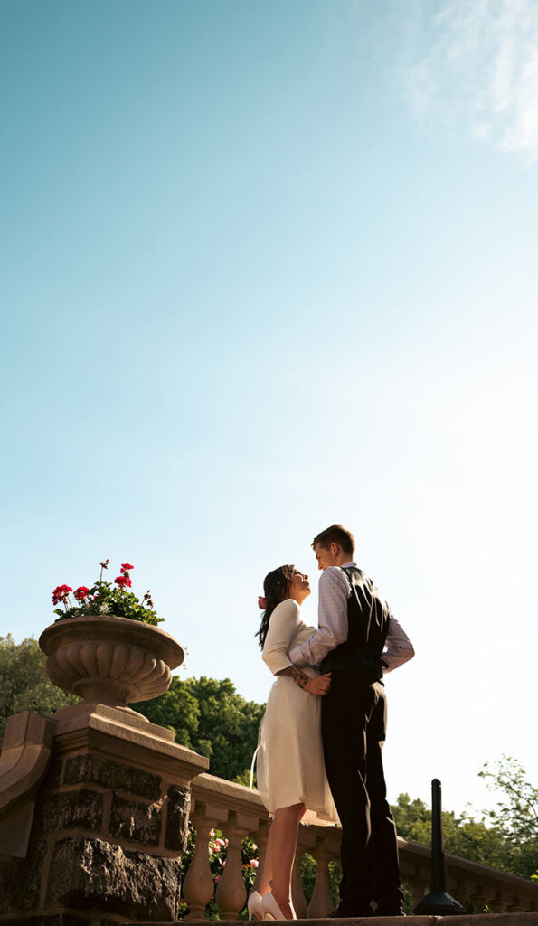 Bride and Groom outside of Mansion on fifth