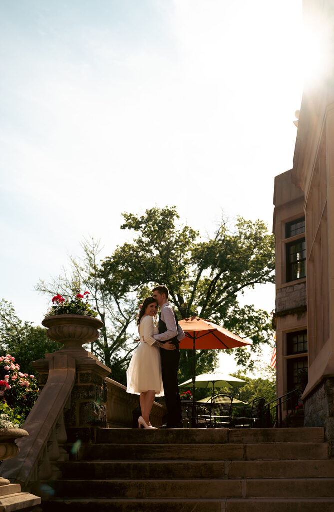 Bride and Groom outside of Mansion on fifth